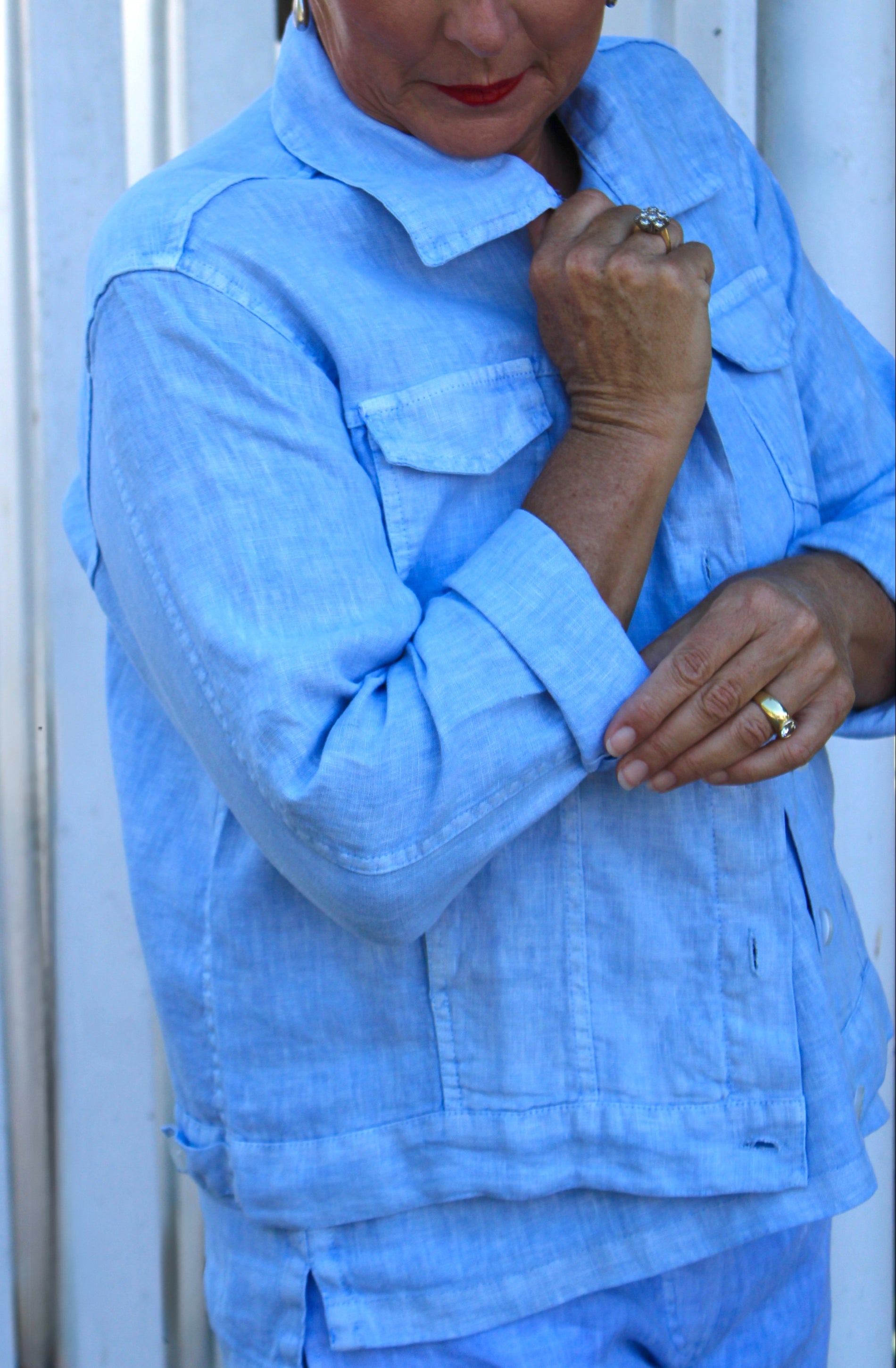 Person wearing a sky blue outfit with a close-up of the jacket.